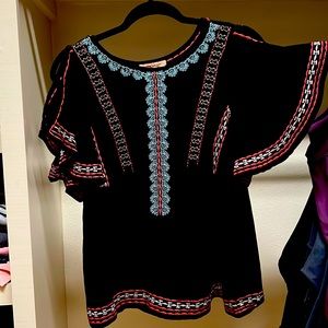 Black thread-work blouse.